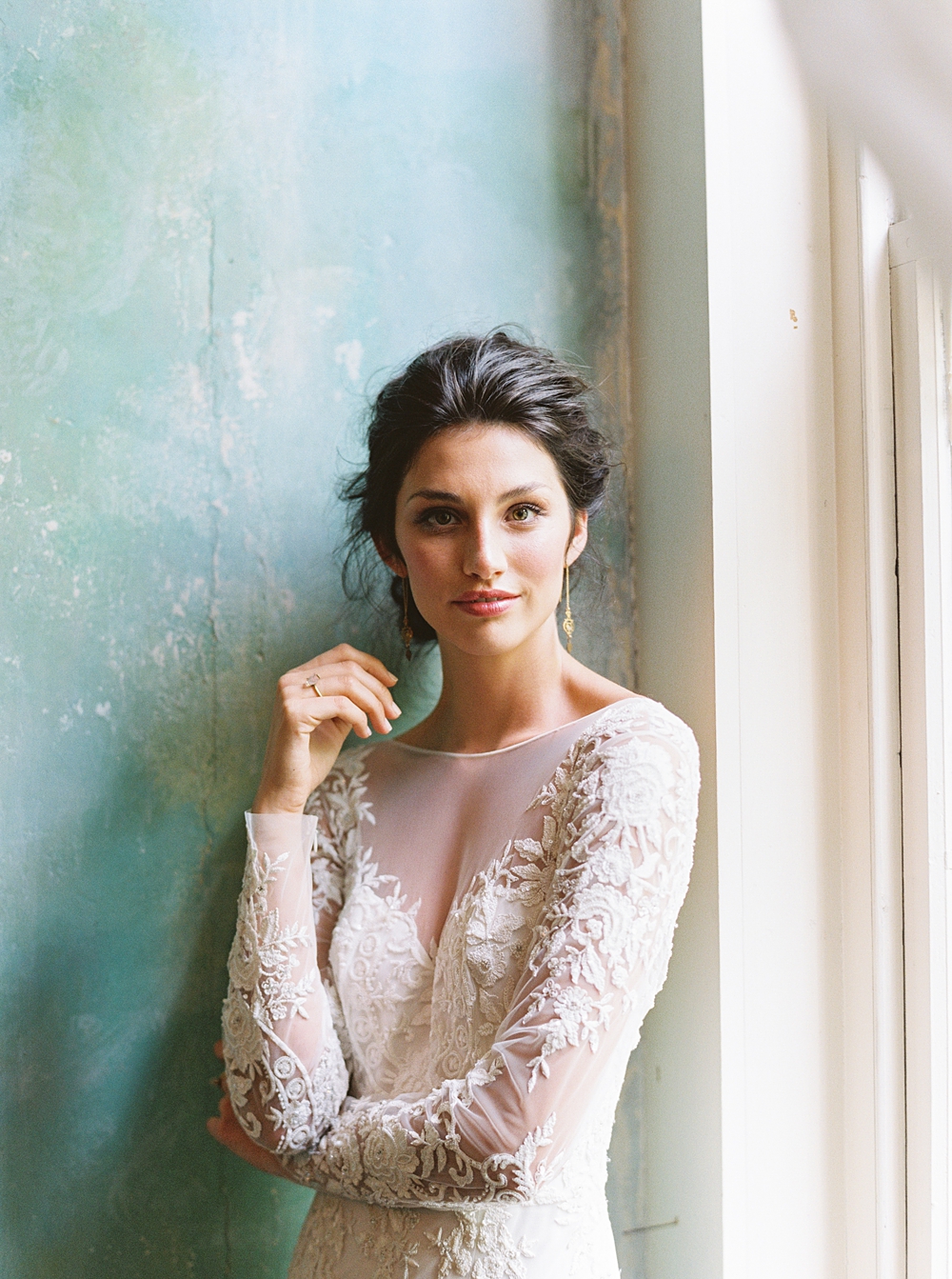 Bride in lace dress with updo in front of blue painted wall in Riverwood Mansion, southern wedding in Nashville, Charlottesville wedding photographer
