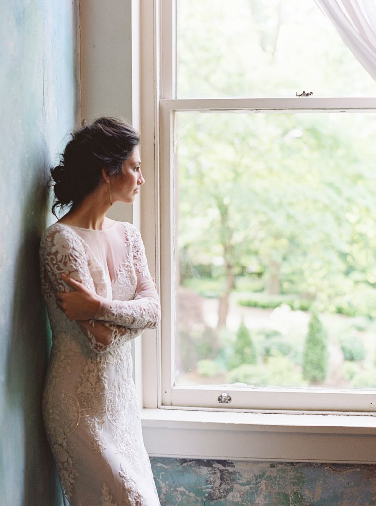 bride in lace wedding dress with updo in front of blue painted wall, Riverwood mansion wedding, southern wedding photographer, Virginia wedding photography