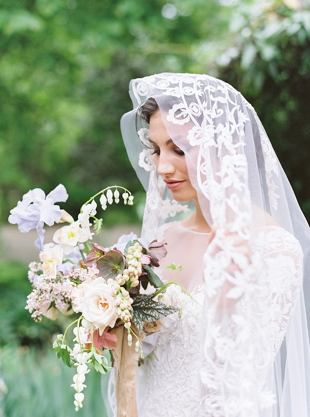 spring wedding bouquet, purple yellow pink red bouquet, wedding flowers, bride bouquet, iris hellebore daffodil wedding bouquet, bride in vintage lace wedding veil