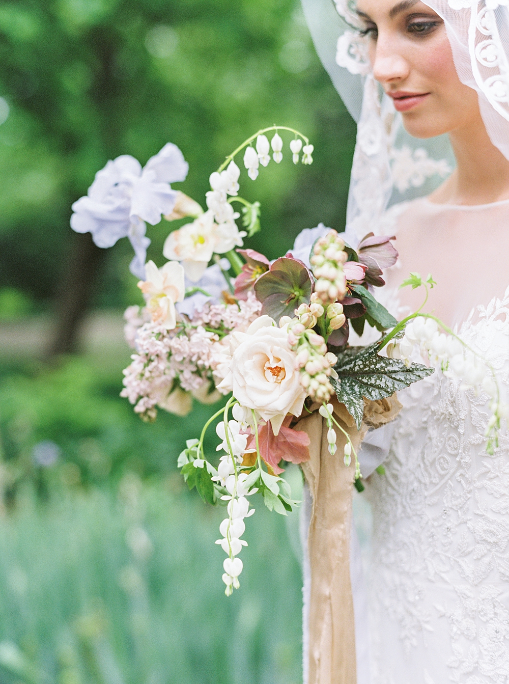 spring wedding bouquet, purple yellow pink red bouquet, wedding flowers, bride bouquet, iris hellebore daffodil wedding bouquet, bride in vintage lace wedding veil