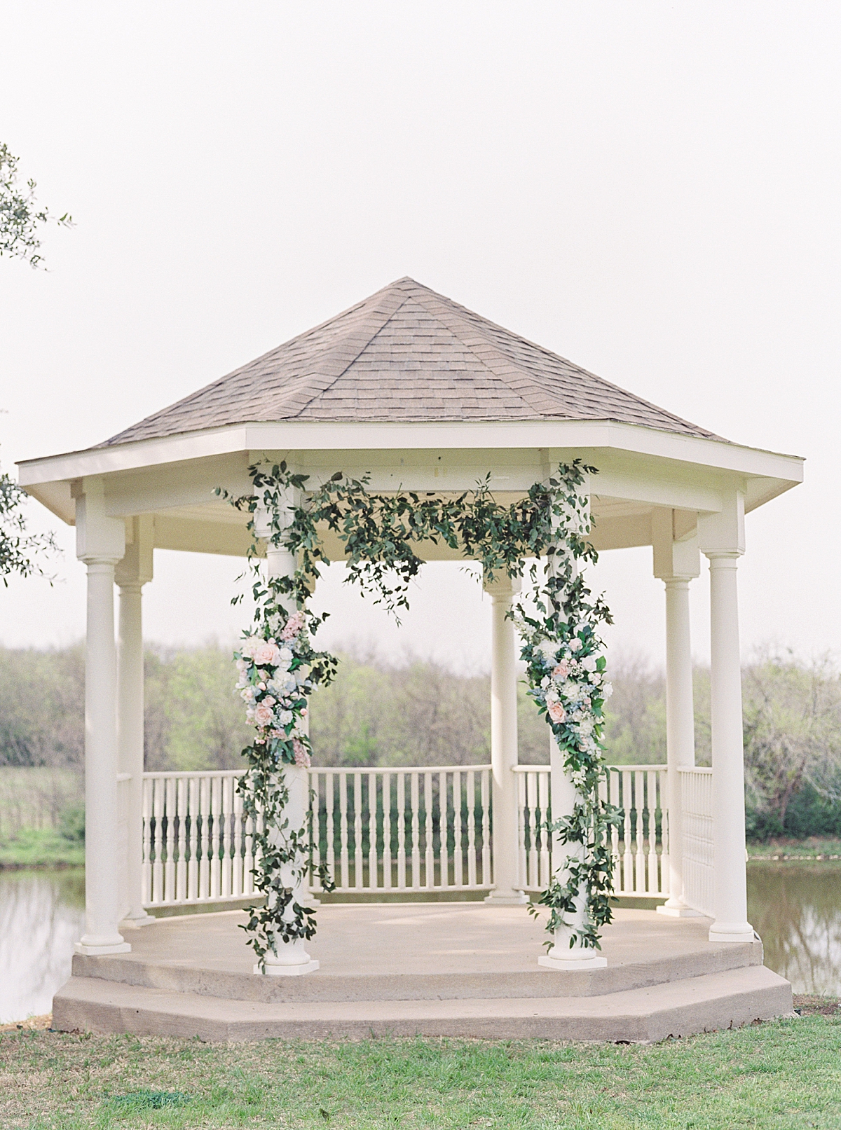 wedding white gazebo with flower arch, pink and white wedding flowers with greenery, wedding ceremony backdrop, DFW wedding photographer