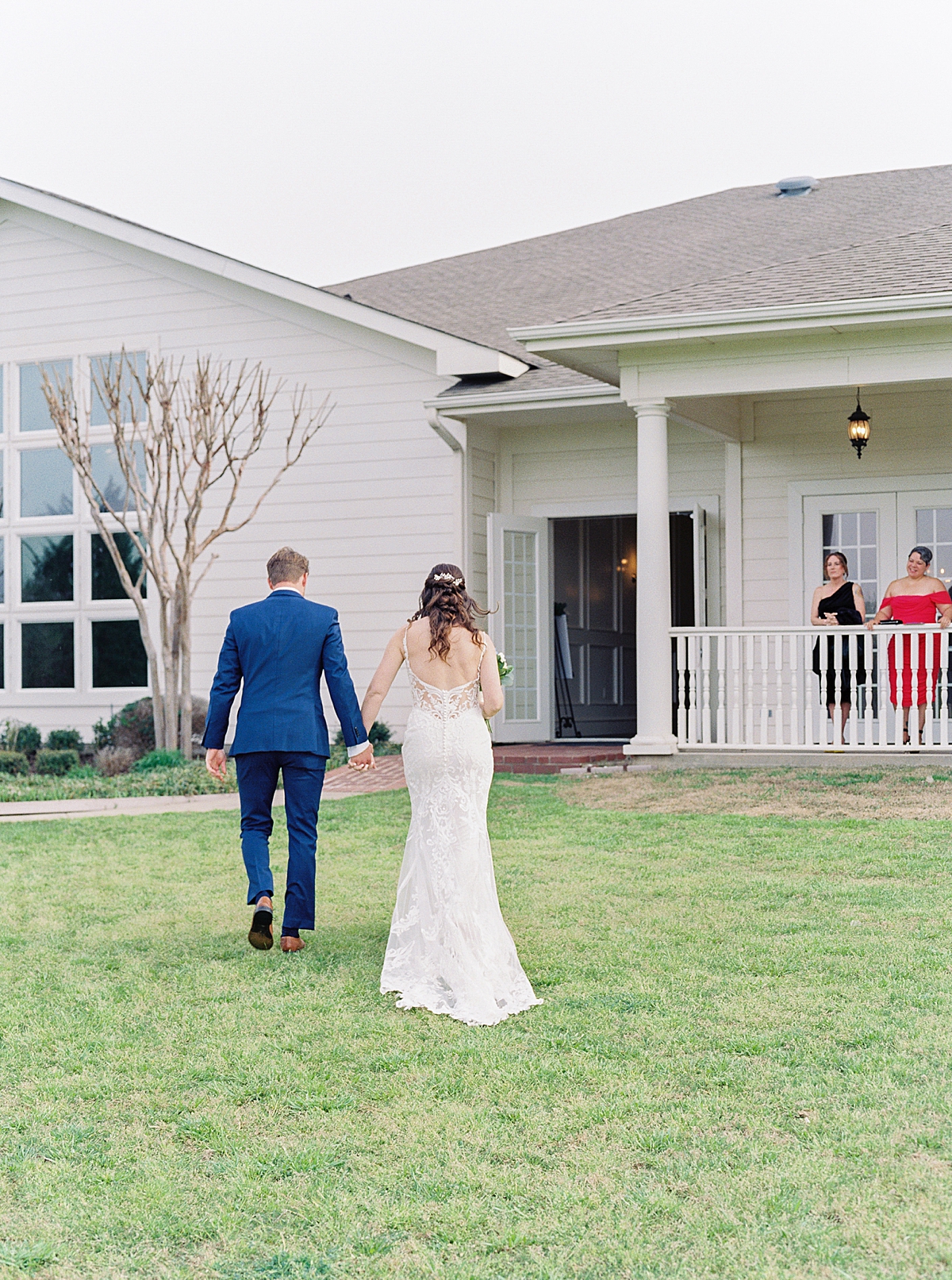 Bride and groom walking hand in hand after wedding ceremony
