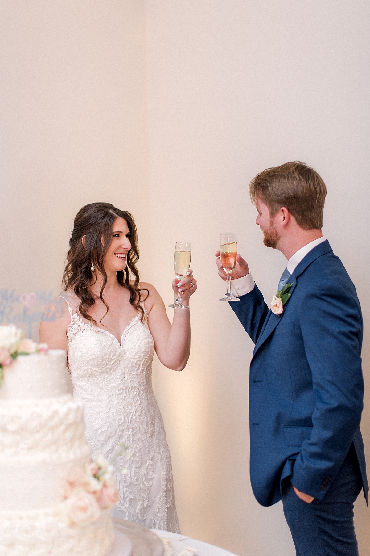 Bride and groom toast with champagne during wedding reception, elegant southern wedding