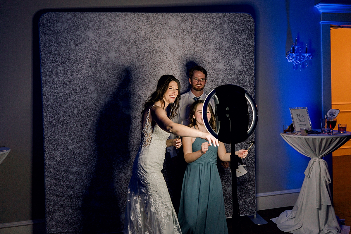 Bride and groom in Photo Booth at wedding reception