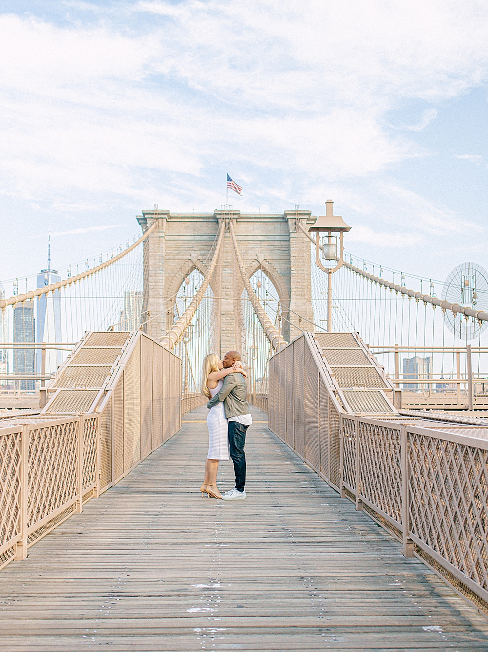 Bride and groom on the Brooklyn Bridge for engagement photos in New York City